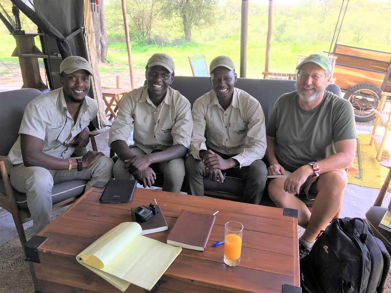 The Wild Source Big Cat Project team seated together at Njozi Camp