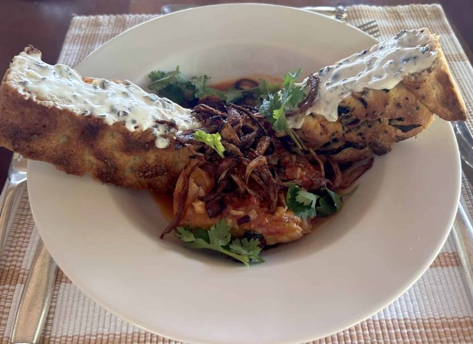Fresh caught tilapia dish with homemade focaccia bread. (Photo Credit: Alexandra Hankins)