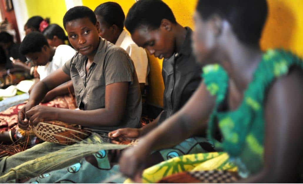 Rwandan women weaving baskets at Gahaya Links