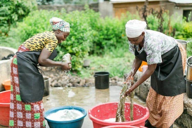 Women at Handspun Hope washing wool by hand in Rwanda